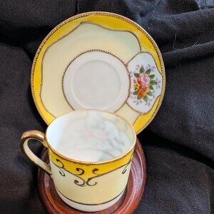 Porcelain demitasse cup and saucer set with floral design by Ardalt